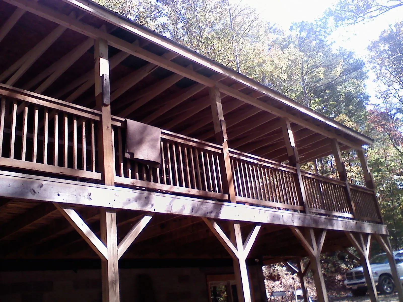 Timber framing under a new elevated porch and deck — Roof Leak Repair in Dracut by Roofing Brothers